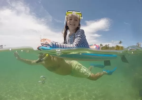 little girl snorkeling in kauai