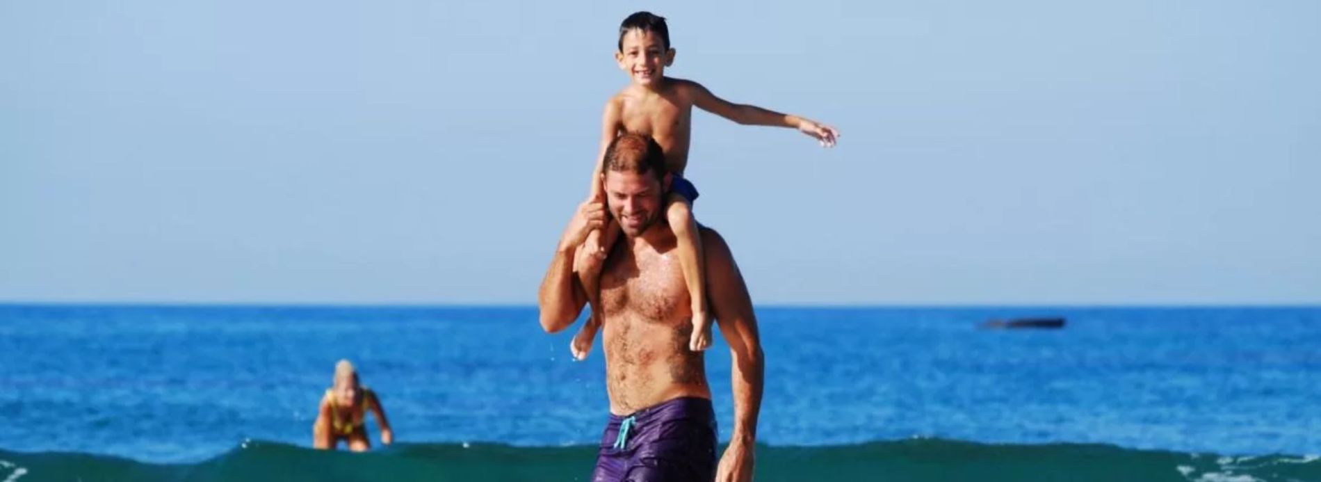 Father and son surfboarding